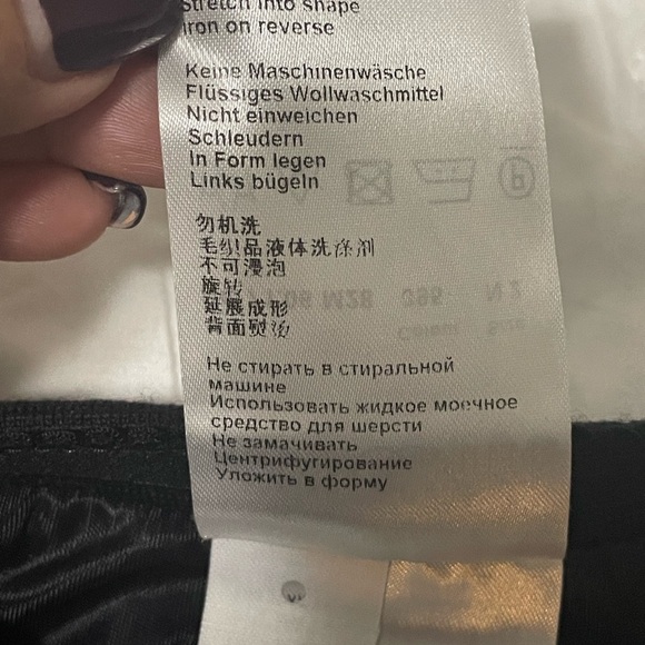 Marc Cain knit black knee length skirt with metallic silver side seams. - Picture 10 of 14